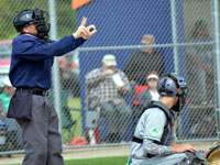 FBOA member Dale Yoder umpires a state tournament baseball game.