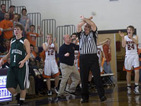 FBOA member Dave Buck signals an intentional foul in the 2010 Bridgman/Napoleon quarterfinal basketball game.